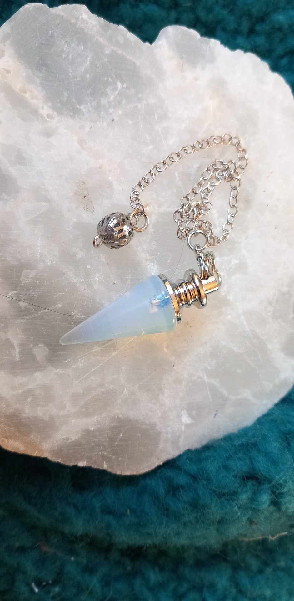 Spiss Pendulum. Ass krystaller